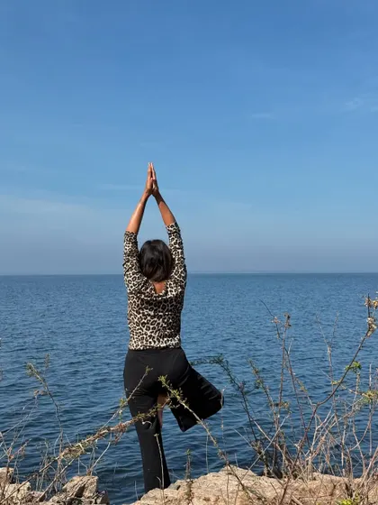 Strength in stillness. Holding Tree Pose (Vrksasana) while gazing out at the water, guided by the rhythm of the ripples.