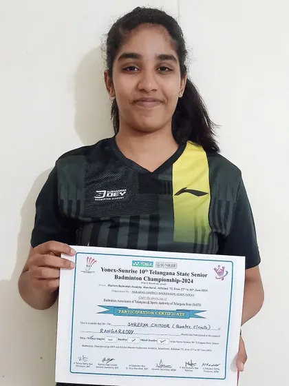 Shreeya Chittoor holding her participation certificate after reaching the quarterfinals in both Women’s and Mixed Doubles at the Telangana State Senior Championship. Our academy offers dedicated training for doubles specialists.