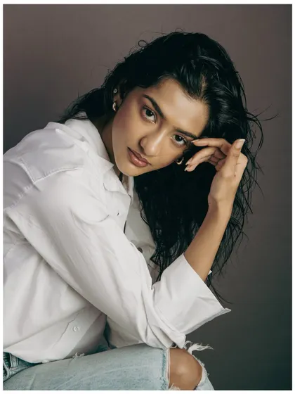A softer, more thoughtful portrait from the same series. Showing a range of expressions is key for a strong model book.