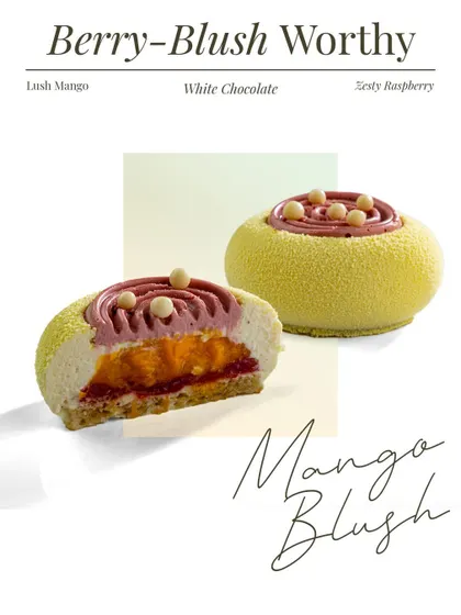 The Mango Blush entremet is a play of juicy mango and punchy raspberry. The cross section shows how they are swirled into an airy white chocolate mousse and set on a soft vanilla sponge.