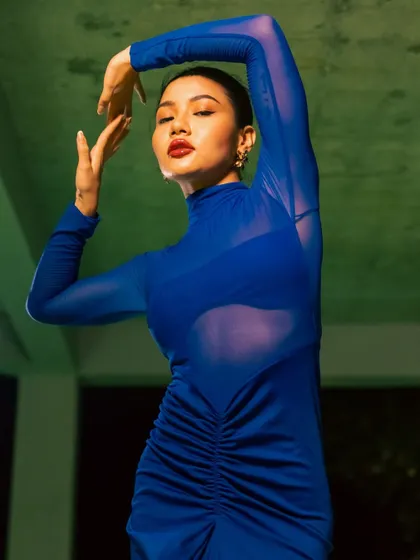 Another shot from the "blue-tiful" shoot with NewMe. The combination of the bold colors and the model's powerful pose creates a truly memorable fashion image.