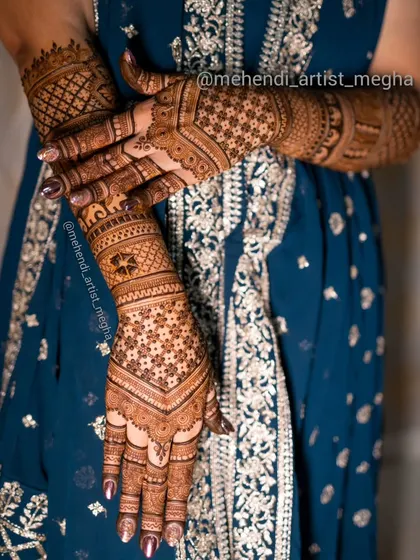 A full view of the geometric back-of-hand design, showing how it extends up the arms with matching patterns. The elephant band adds a touch of traditional charm.