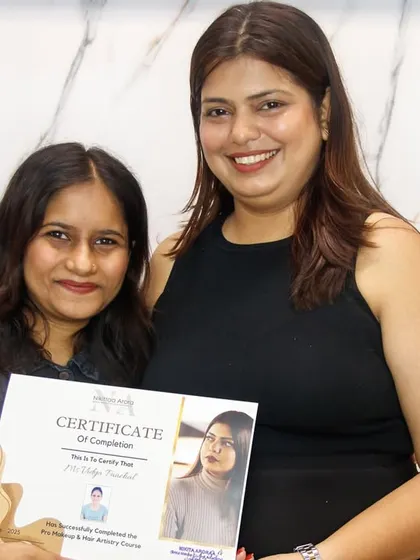 Presenting a certificate of completion to another one of my dedicated students. She is now equipped with pro-level skills for her freelance career.