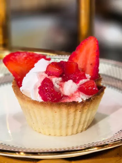 A perfect, bite-sized taste of summer. Our Strawberry Tart features a crisp, buttery crust filled with fresh cream and topped with sweet, juicy strawberries.