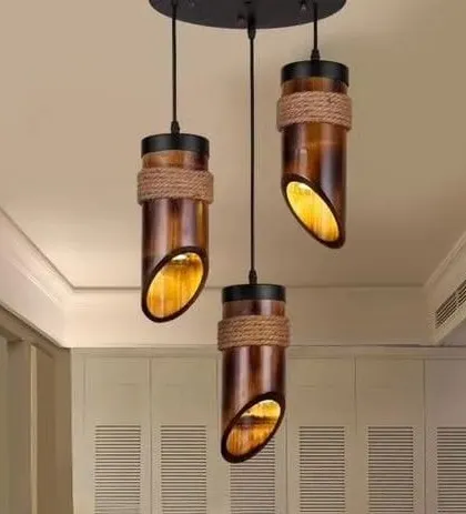This cluster of three hanging lights, made from treated bamboo sections and natural rope, offers a rustic yet modern look. It's a perfect lighting solution for a kitchen island, bar area, or entryway.
