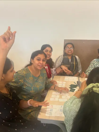 Educators at a 'Math from Scratch' professional development workshop actively participate in a game of Yonjuu. My goal is to empower teachers with hands-on strategies they can immediately bring back to their own classrooms, making math both fun and conceptually clear.