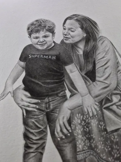 A tender moment between a mother and her son, drawn with graphite pencil. These family portraits are designed to be treasured for years.