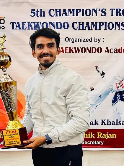 Holding our hard-earned 2nd place trophy from the Champions Trophy 2023.
