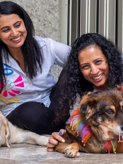 Sisters sharing a laugh with their two senior dogs. It was a joy to capture the deep bond they've built over the years.