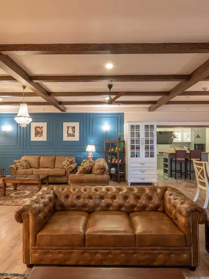 A complete view of the open-plan living, dining, and bar areas. This design is a testament to how different styles, from industrial to Victorian, can be harmoniously blended to create a cohesive and stunning home.