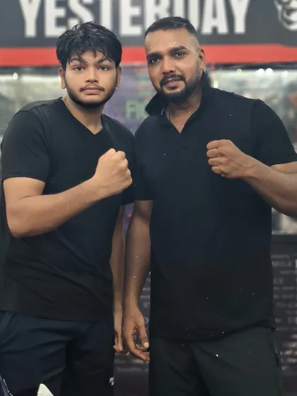 Posing with a student. We are a team, inside and outside the gym.