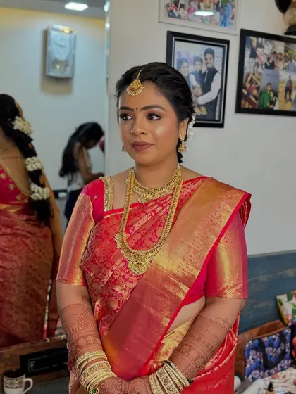 A portrait of the bride, showcasing her elegant temple jewellery and the soft, glowing makeup that enhances her features.