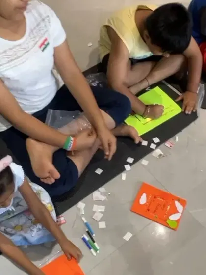 A close-up of the crafting process. Kids are focused on assembling their light-up greeting cards, learning about circuits through a fun, hands-on art project.
