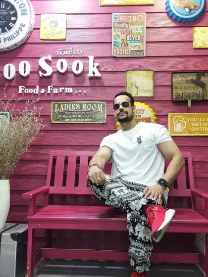 Enjoying the unique atmosphere at 1,000 Sook Food and Farm in Thailand. It's fun to explore new places and cultures.
