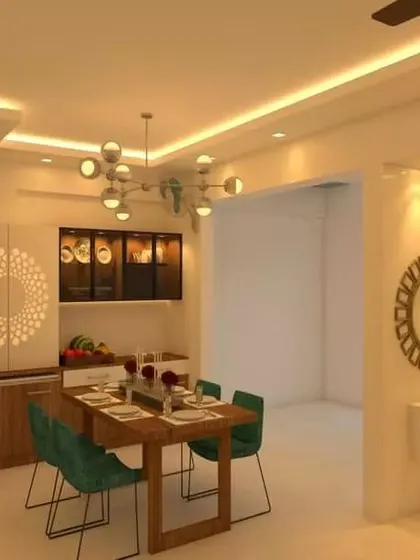 This dining space at United Blossoms features a beautiful wooden table, a modern chandelier, and a crockery unit with a unique circular CNC cut design.