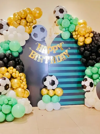 Another angle of the football setup, showing how the two balloon pillars create a grand entrance feel.