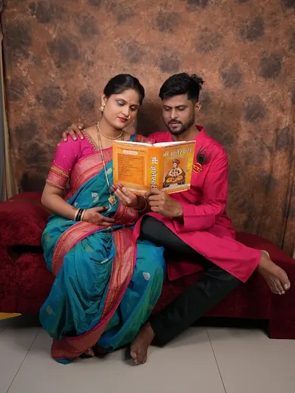 A lovely couple's shot during a traditional maternity photoshoot. The coordinated outfits look wonderful together.