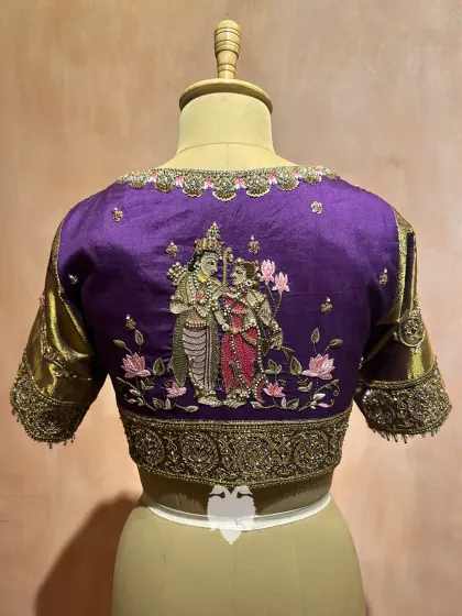 The back of the Janaki Rama inspired blouse, showcasing the divine couple surrounded by lotuses, a cultural homage beautifully crafted to reflect heritage.