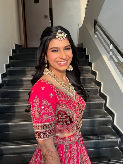 Another beautiful portrait of the bride. Her smile shows her confidence and happiness with the final look.