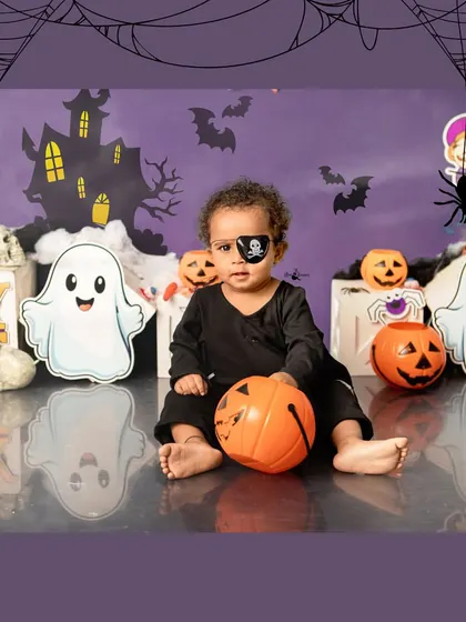 A little pirate ready for a spooky adventure. The eyepatch and pumpkin basket complete this adorable trick-or-treating look.