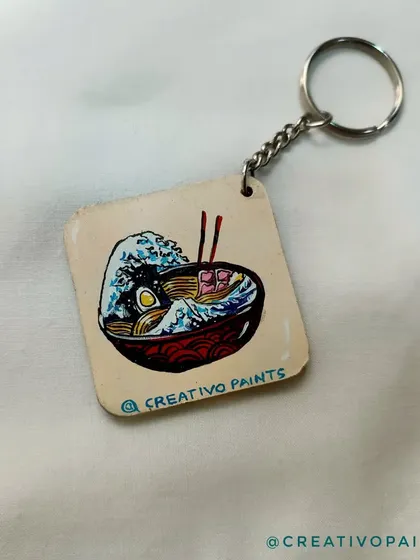 This keychain combines two great things: ramen and classic Japanese art. I painted a delicious-looking ramen bowl with a background inspired by Hokusai's "The Great Wave," a perfect custom gift for a foodie.