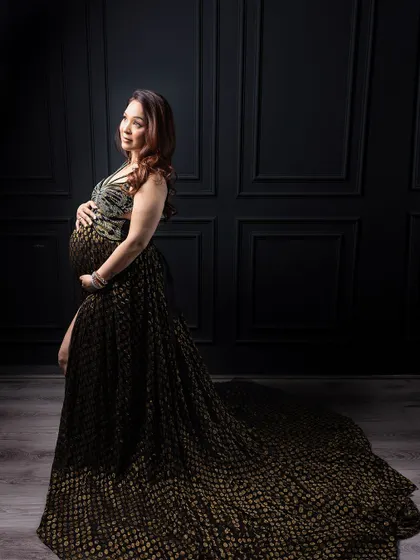 One of my most cherished images. This handcrafted black and gold dress against a Victorian-style wall is the definition of glamour.