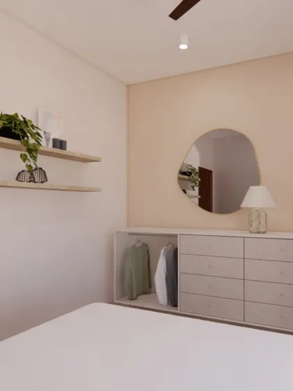A detail from a Japandi bedroom, showing a minimalist chest of drawers with an open section for frequently used items. The design uses light wood tones and an organic-shaped mirror to maintain a sense of calm and order.