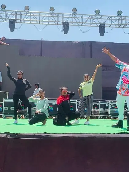 Our dancers rehearsing on a massive stage for a BJP Mahila event in Belgaum. We are equipped to handle the technical requirements and scale of large outdoor events.