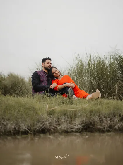A peaceful moment by the water, reflecting the tranquility of their relationship. Natural settings provide a beautiful canvas for authentic couple portraits.