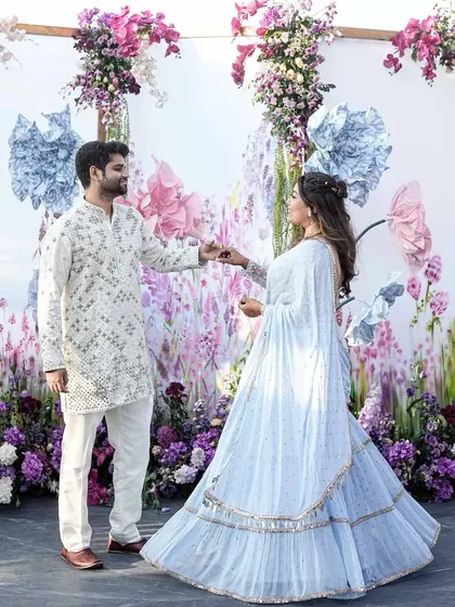 Telling a cross-cultural love story through design. For a British-Indian couple, we created the 'Victorian Bageecha' theme, blending English floral aesthetics with traditional Jaipur block prints for their rooftop mehendi.