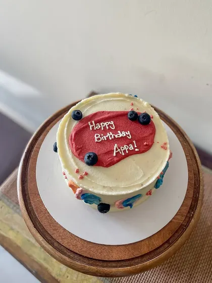 A simple and modern cake for Appa's birthday. This blueberry lemon curd cake is decorated with abstract buttercream swipes of color and fresh blueberries.