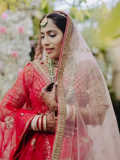 A beautiful shot of the bride with her veil. The soft glam makeup ensures she looks ethereal and timeless.