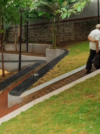 **Nepean Greens, Mumbai:** Accessibility was a key consideration. We designed a continuous, gently sloping ramp alongside the steps to ensure the plaza is welcoming and usable for the elderly and people with disabilities, connecting two streets at different levels.
