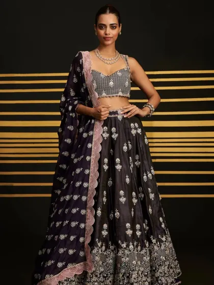 Another look at the elegant Sathi Purple Lehenga. The embellished blouse adds the perfect amount of sparkle for a cocktail event.