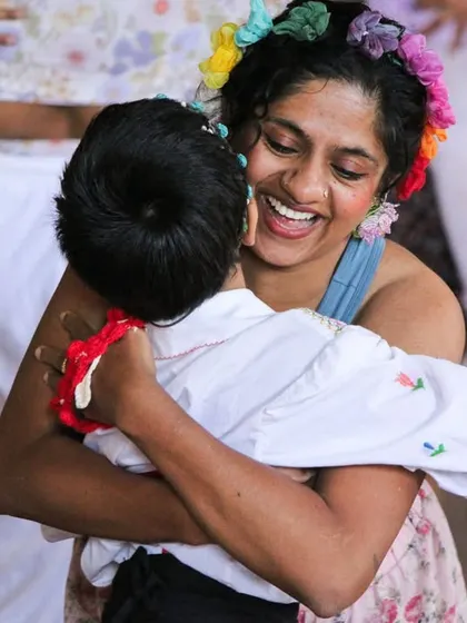 A joyful hug between a student and their mother. Our studio is a place where these warm, heartfelt connections are celebrated.