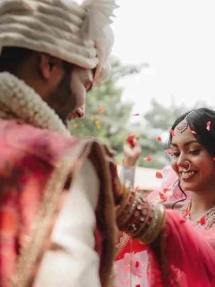 A stolen glance between the bride and groom during the ceremony. These quiet, intimate moments are just as important as the grand celebrations.