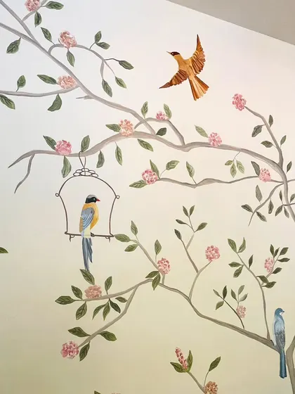 A detailed close-up of the birds and flowers in the Cafe Wink mural, showcasing the delicate brushwork.