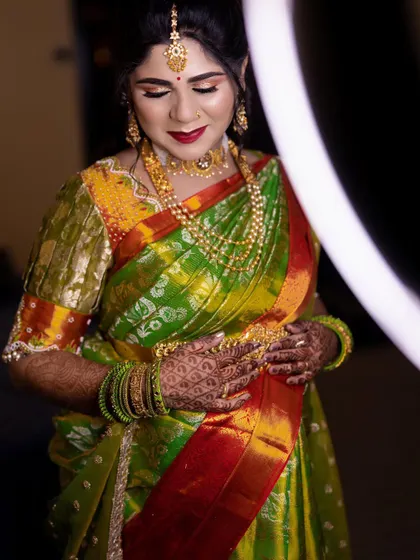Captured under the ring light, her makeup looks absolutely flawless. The soft glam and bold lip create a perfect look for her baby shower celebration.