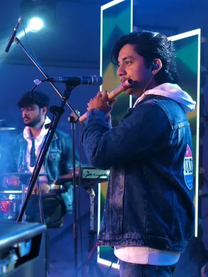 Our talented flutist lost in the music during our performance at RVITM. Each member of our band brings their own unique energy to the stage.