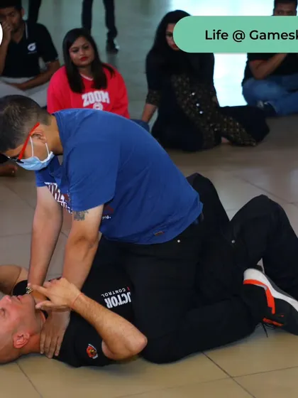 This is a ground survival drill in an office environment. We simulate real-world attacks to prepare employees for the worst-case scenario, teaching them how to protect themselves even when overpowered.