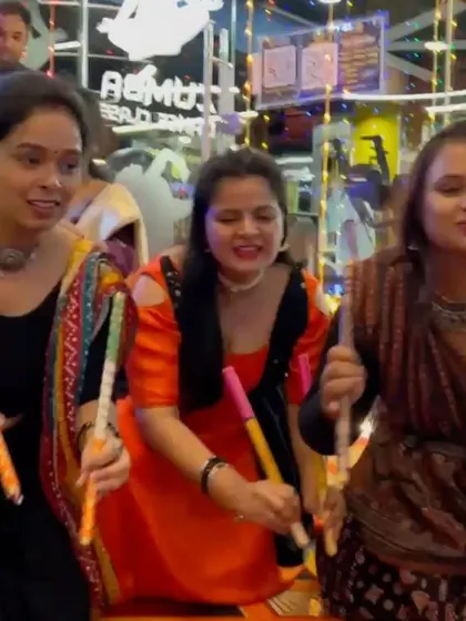 Dancers in action with their dandiya sticks. I teach the proper techniques for dandiya raas, ensuring the performance is both authentic and energetic.