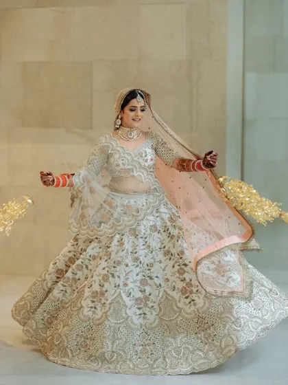 A twirling shot of bride Bhavya, showing the beautiful flare of her lehenga and how our jewellery completes the look.