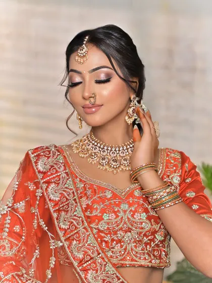 A candid moment that highlights the hathphool and bangles, showing how I can provide a complete set of coordinated jewellery for your hands, tying the whole look together.