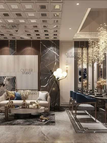 This living and dining area is a world of luxury and sophistication. A double-height dining space with a cascading chandelier is paired with a cozy living area, defined by dark marble and plush seating.