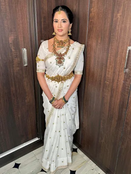 The full view of this stunning white saree, perfect for a traditional ceremony.