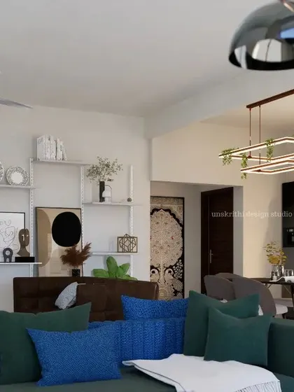 Another angle of the renovated living room, highlighting the open feel and the personal display shelves. The design proves that a room can be both minimal and full of personality, with a focus on what truly matters to the family living there.