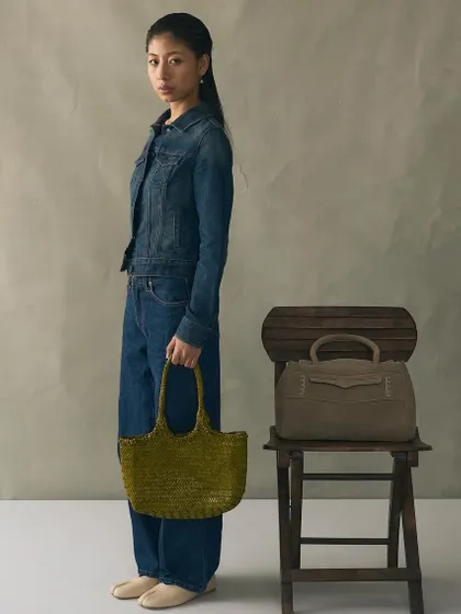 The Penny Carryall in suede and the Foyer Bamboo tote in woven leather. This image is for those who choose texture as their statement, showcasing two of my designs that highlight the beauty of their materials.
