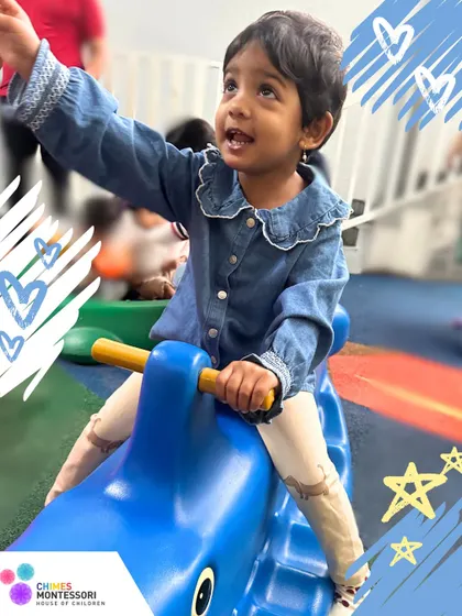 A child enjoys a ride on a rocker in our play area. This simple activity helps develop balance, coordination, and gross motor skills, all while having fun.
