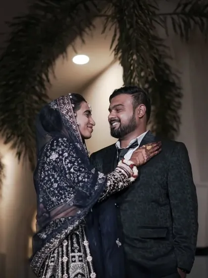 A happy, interactive portrait of the couple at their reception. We encourage natural interactions to capture your genuine personalities.