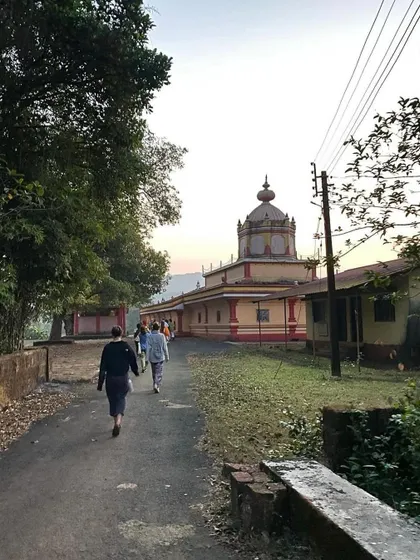 Students walking towards a local temple near the ashram. Our life here includes connecting with the local culture and sacred sites, enriching the spiritual experience.